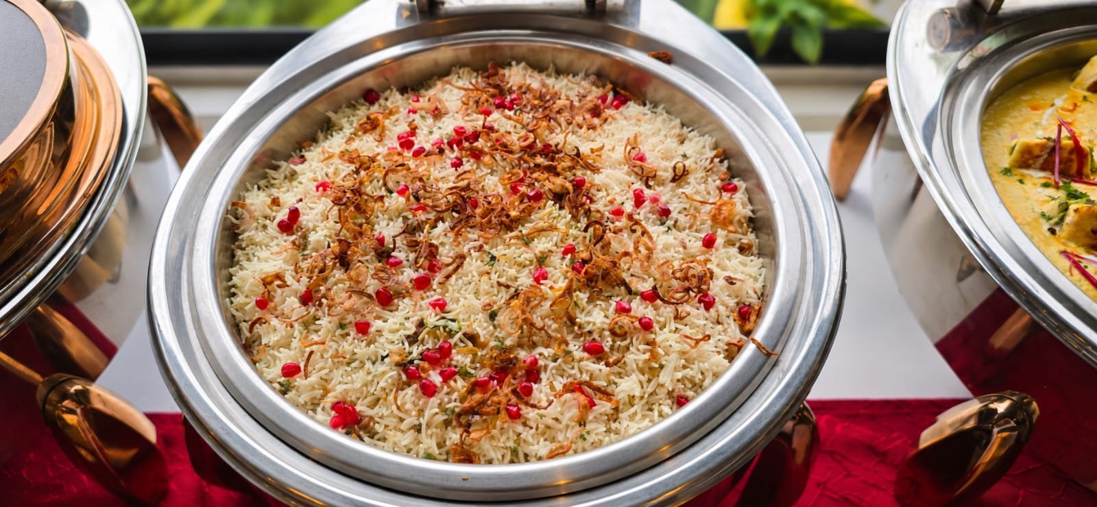 Pomegranate and saffron rice pulao served at a Grandeur Hospitality buffet