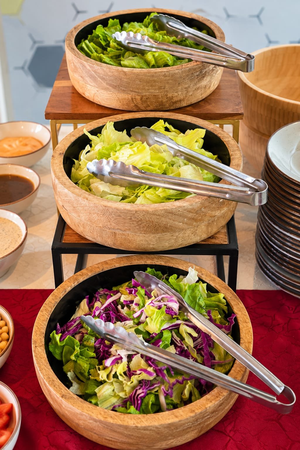 Fresh salad bowls with lettuce and cabbage at a Grandeur Hospitality live counter