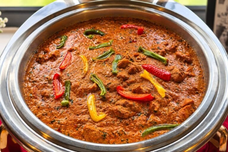 Spiced curry with bell peppers in a chafing dish at a Grandeur Hospitality buffet