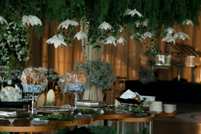 Buffet and food stations decorated with hanging flowers and greenery